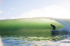 Craig Hunter rides a clean wave at Matakana Island, Mount Maunganui, Bay of Plenty, New Zealand. 