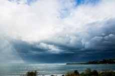 Stormy skies over the Taieri Rivermouth near Dunedin, New Zealand. 