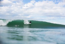 Lyndon Hutton takes off on a wave during a fun surf at Aramoana, Dunedin, New Zealand. 