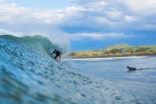 Jack Mcleod (14) tucks into a barrel at Aramoana, Dunedin, New Zealand. 