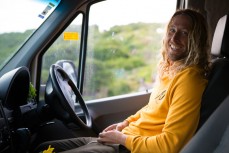 Pro surfer Asher Pacey chills out in the motorhome after a three-surf day on the South Coast during the Damaged Goods Zine Southern roadtrip at Blackhead, Dunedin, New Zealand. 