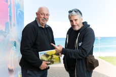 Warren Hawke (left) and Craig Levers (CPL) with Warren's new book NZ SURF Captured By A Surf Lens at the St Clair Boardriders clubrooms in St Clair, Dunedin, New Zealand. 