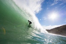 Richie rides a wave at a beachbreak near Raglan, New Zealand. 
