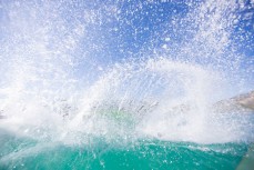 Elliot Brown makes the most of the clear water and playful surf at Blackhead Beach, Dunedin, New Zealand. 