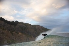 James Steiner turns on a wave at Aramoana Beach, Dunedin, New Zealand. 