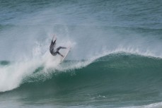 Luke Grubb on a great wave at Aramoana Beach, Dunedin, New Zealand. 