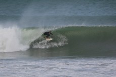 Duan Reardon rides deep in a barrel at Aramoana Beach, Dunedin, New Zealand. 