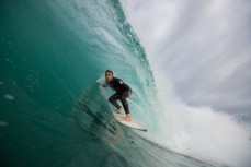 Ben Lacy rides the barrel during a surf at a beach in Raglan, Waikato, New Zealand. 