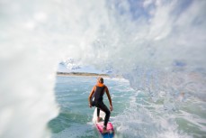 Charlie Cox races onto the flats on a wave at Aramoana, Dunedin, New Zealand. 
