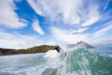 A surfer turns off the lip in fun waves at Blackhead Beach, Dunedin, New Zealand. 