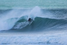 Jimi Crooks throws some spray in fun waves at Aramoana, Dunedin, New Zealand. 