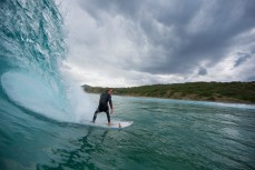 A young surfer makes the most of fun, glassy conditions at Blackhead Beach, Dunedin, New Zealand. 