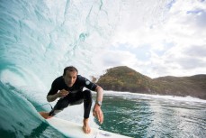 Brett Wood rides inside a barrel at a remote beach break near Raglan, Waikato, New Zealand. 