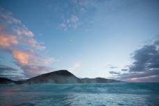 A wave breaks at a remote beach break near Raglan, Waikato, New Zealand. 
