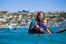 Southcoast Boardriders Club president Craig Higgins with his son Jack in the lineup at the inaugural Duke Longboard Festival to celebrate 100 years since Duke Kahanamoku visited St Clair Beach, Dunedin, New Zealand. 