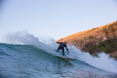 Richard Ayson turns on a wave at Whareakeake, Dunedin, New Zealand. 