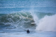 Jamie Civil in the froth during cyclone Pam at Aramoana Beach, Dunedin, New Zealand. 
