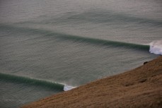 Swell lines from Cyclone Pam at a remote point break on the North Coast of Dunedin, New Zealand. 