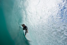 Richie Cowie gets squeezed in the tube during a new swell at a beach near Raglan, New Zealand. 