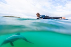 Taya Morrison (9) watches a Hector's Dolphin at Curio Bay in the Catlins, Southland, New Zealand. 