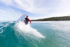 Maz Quinn unleashes in playful waves at Blackhead Beach, Dunedin, New Zealand. 