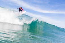 Maz Quinn floats a section in playful waves at Blackhead Beach, Dunedin, New Zealand. 