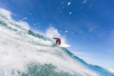 Maz Quinn off the top in playful waves at Blackhead Beach, Dunedin, New Zealand. 