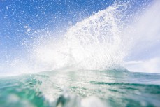 Maz Quinn unleashes in playful waves at Blackhead Beach, Dunedin, New Zealand. 