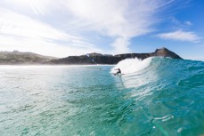 Maz Quinn coiled in playful waves at Blackhead Beach, Dunedin, New Zealand. 