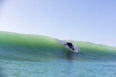 Knifing in on a small clean wave at Aramoana Beach, Dunedin, New Zealand. 