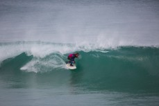 A surfer gets barreled during the Dunedin Surf Academy competition at St Clair Beach, Dunedin, New Zealand. 