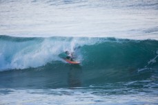 A surfer gets barreled at St Clair Beach, Dunedin, New Zealand. 