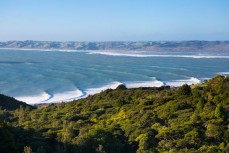 A big ground swell wraps into the points at Raglan, Waikato, New Zealand. 