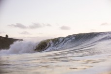 A wave breaks through the Ledge during a rising swell at Manu Bay, Raglan, New Zealand. 