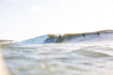 Nat Hughes turns in the pocket in a rising swell at Manu Bay, Raglan, New Zealand. 