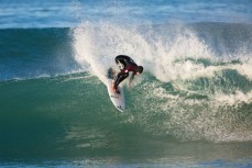Joe Palmer slices the top off a fun wave at Blackhead Beach, Dunedin, New Zealand. 