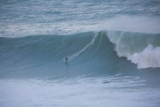 Nick Smart rides a huge wave at Papatowai in the Catlins, New Zealand. 