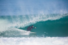 A surfer gets barreled at St Kilda Beach, Dunedin, New Zealand. 