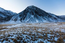 Glen Aspin walks past an icy peak during an ice climbing trip in a series of hidden valleys near Hanmer, Marlborough, New Zealand. 