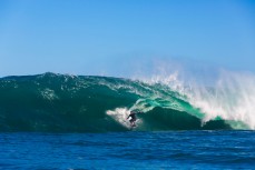 Sam Hawke hits the step during a tow session at a remote reefbreak near Dunedin, New Zealand. 