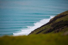 Swell lines wrap into the north coast of Dunedin, New Zealand. 