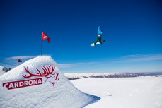 A snowboarder floats the big booter at the Cardrona Park at Cardrona Alpine Resort, Wanaka, New Zealand. 