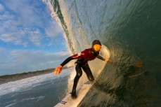 Joe Palmer slots into a hollow wave at St Kilda Beach, Dunedin, New Zealand. 