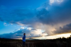 Glenn Cullen watches clouds amass during a trip to Ruapehu, Ruapehu, New Zealand.