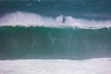 Dan "Delta" Smith rides a giant wave in the Southern Catlins, Southland, New Zealand. 