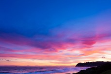 Waves break at dusk at St Kilda Beach, Dunedin, New Zealand. 