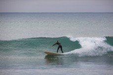 A surfer drives around a wall at St Clair Point, Dunedin, New Zealand. 