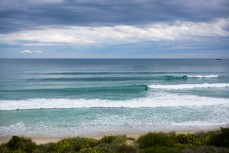 Small waves peel along a sandbank at St Kilda Beach, Dunedin, New Zealand. 