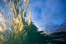 Afternoon light plays on the ripples in waves at St Kilda Beach, Dunedin, New Zealand. 