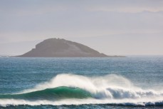 A wave breaks at Blackhead Beach, Dunedin, New Zealand. 